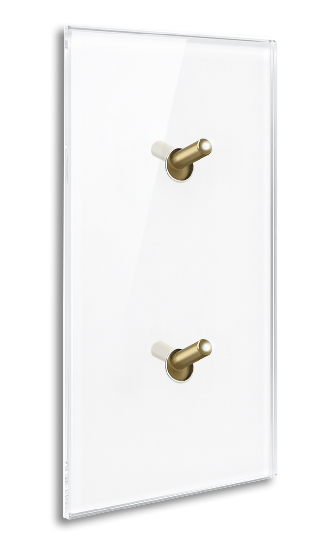 Modern illuminated design light switch in white glass optic vertical with 2 brass toggle levers. YORK