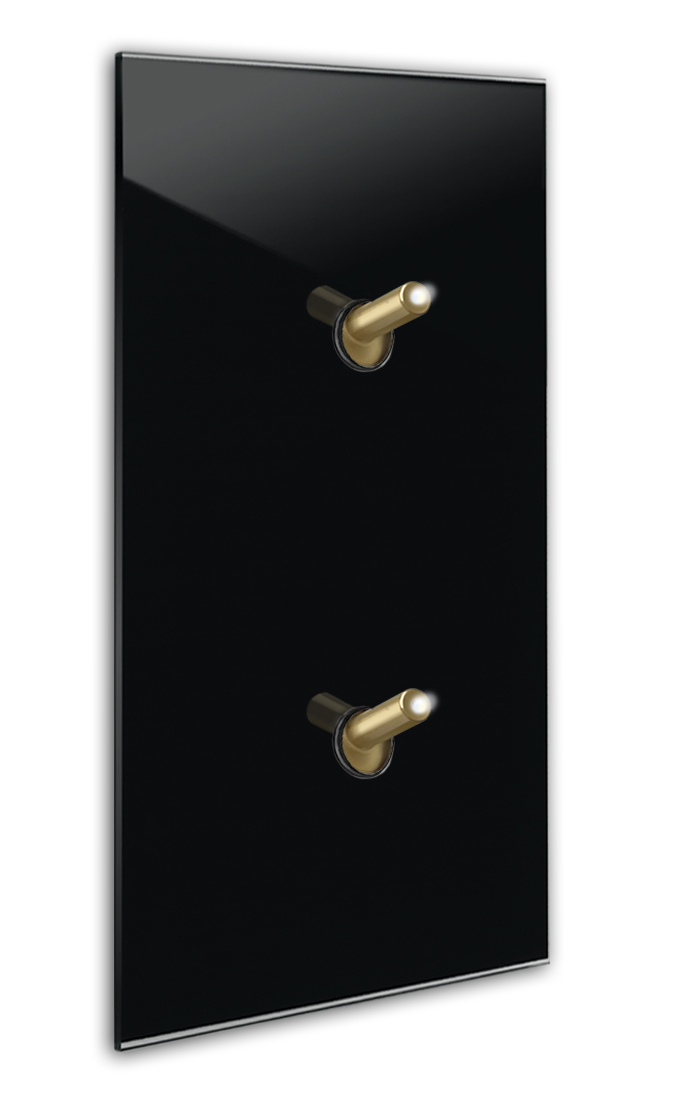Modern illuminated design light switch in black glass optic vertical with 2 brass toggle levers. YORK
